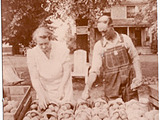 Lydia and August Hill selling peaches